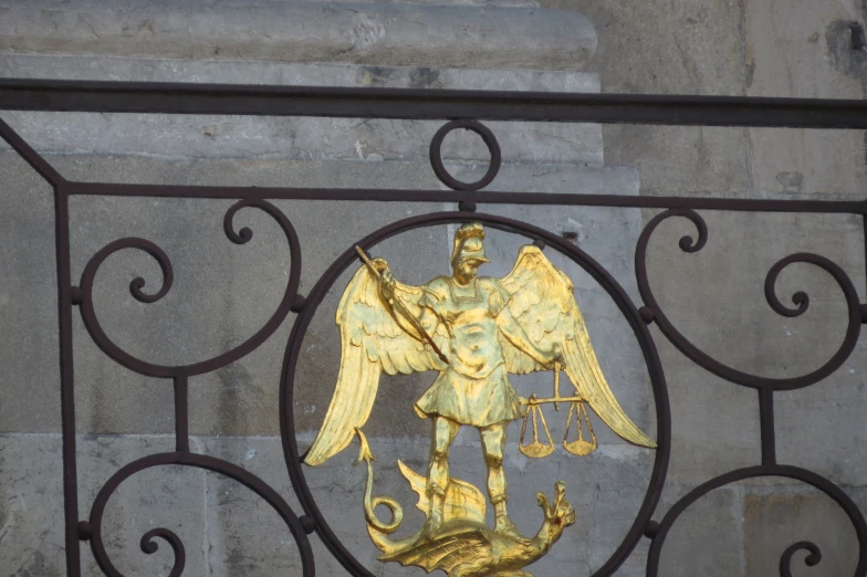 a decorative bronze figurine with an eagle above it