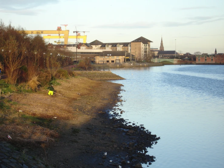 the view from a beach of buildings on the water