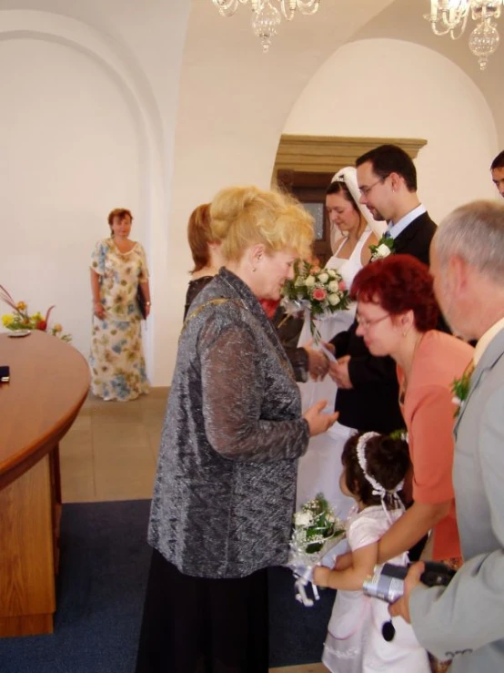 there are people standing together in the church