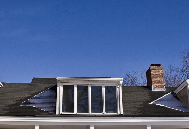 a po of a large house with a chimney