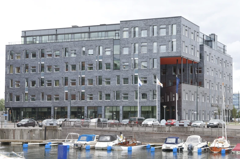 a building with a car parking lot in front of it