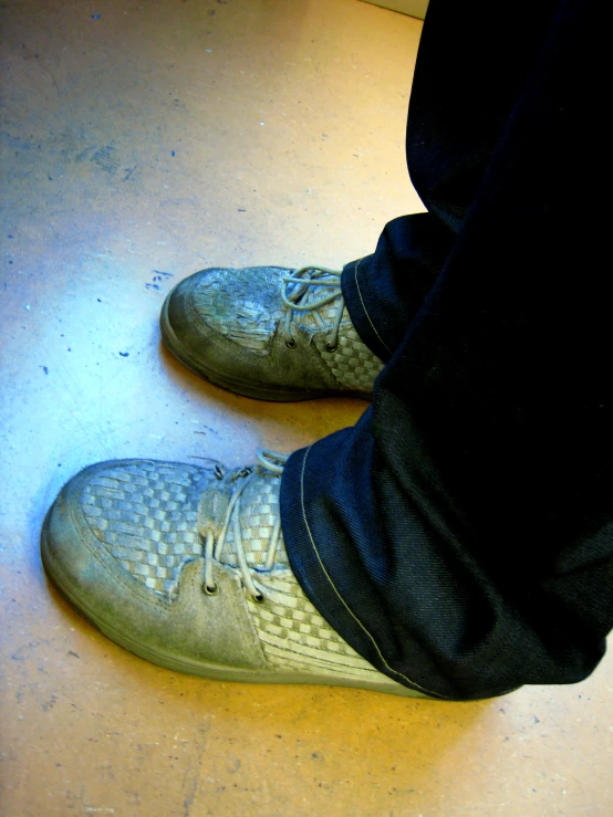 a pair of gray shoes on a floor