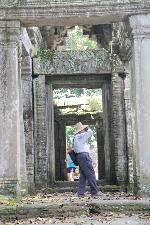 a person is taking pictures of the ruins