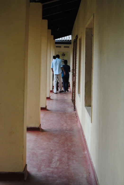 a group of people standing around a building together