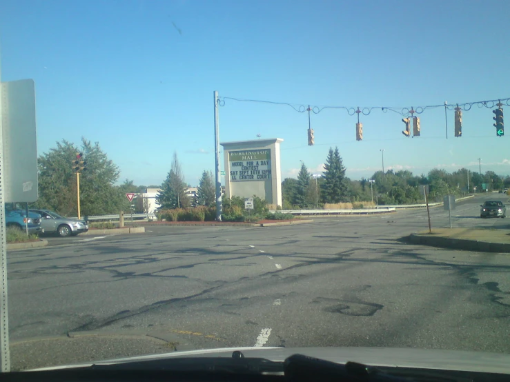 a building on the corner of a street that is near cars and buildings