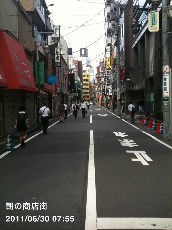 the people are riding down the street on their bikes