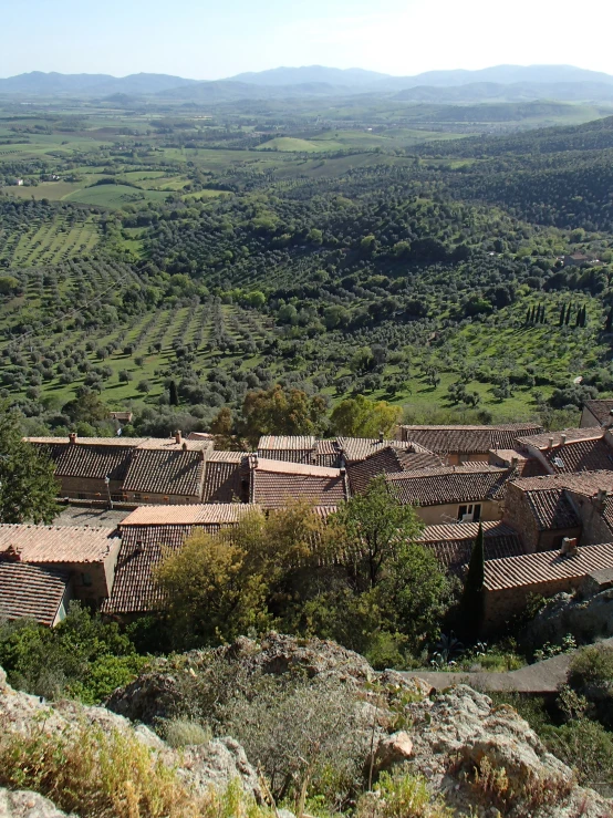 an area with houses and many hills in the background