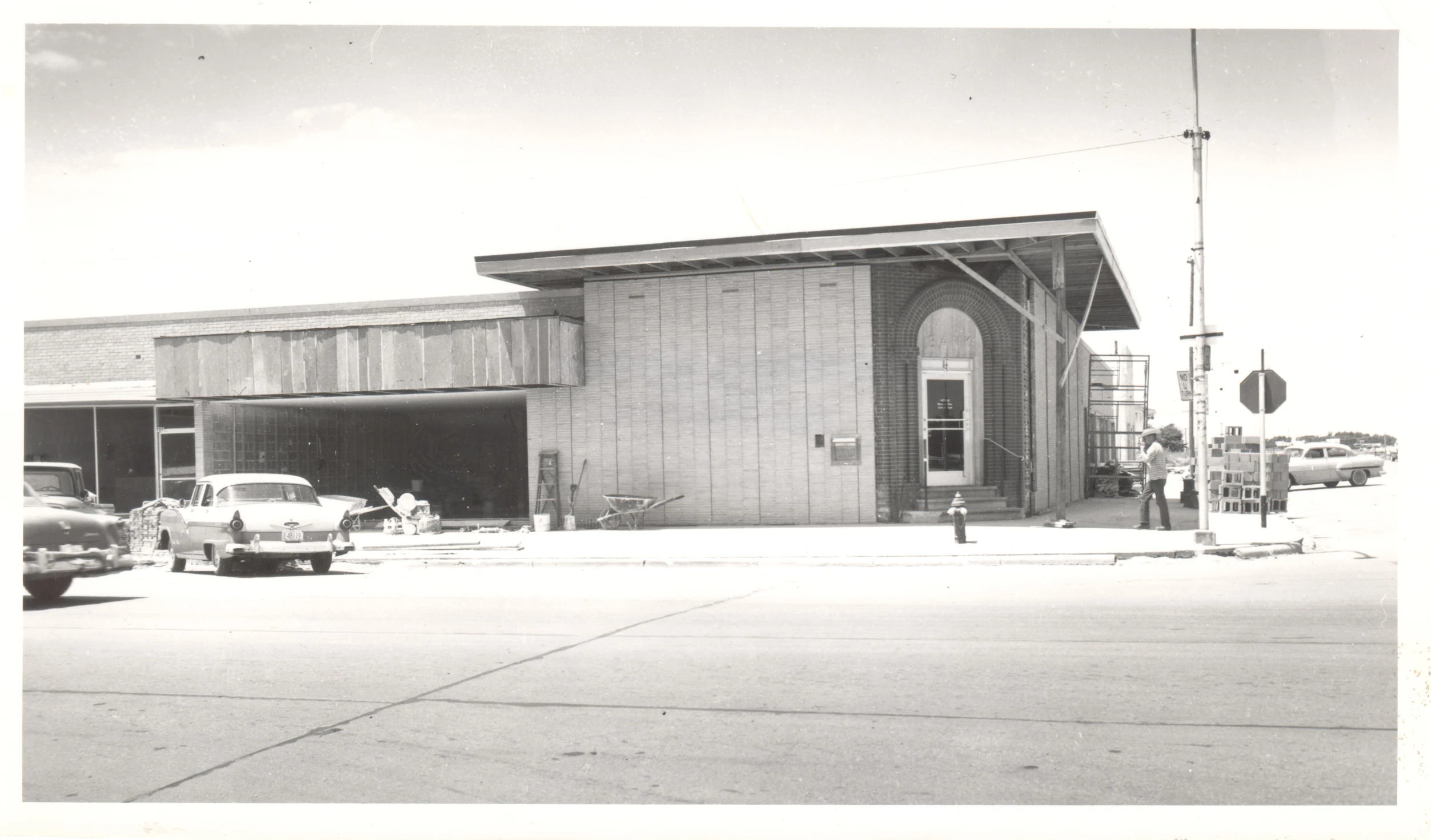 vintage black and white po of an old factory with a door