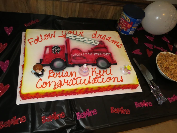 cake with the names of people on it sits on a table