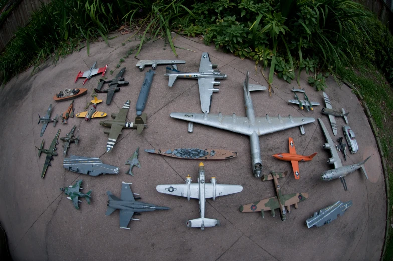 a group of model airplanes are on the ground