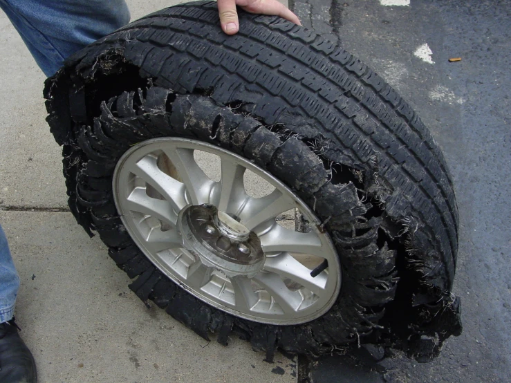 a person holding the tires of a truck