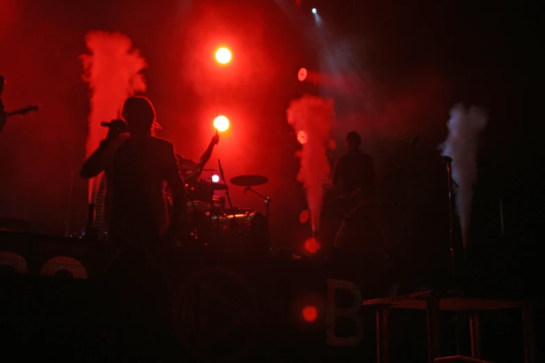 group of people playing on stage in bright lights