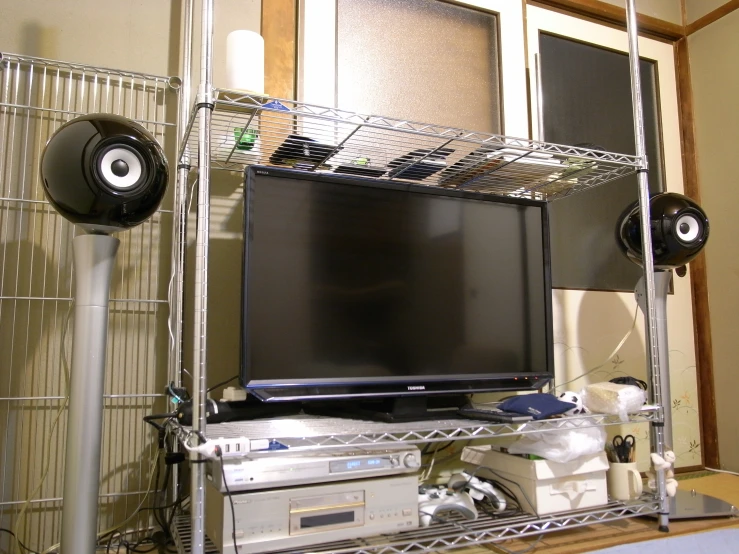 the entertainment center in the living room is equipped with various electronics