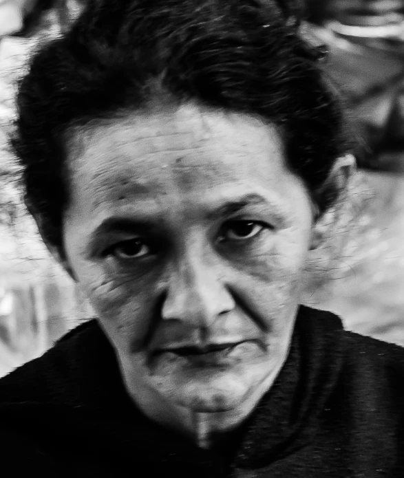 a black and white po of an older woman looking in the camera