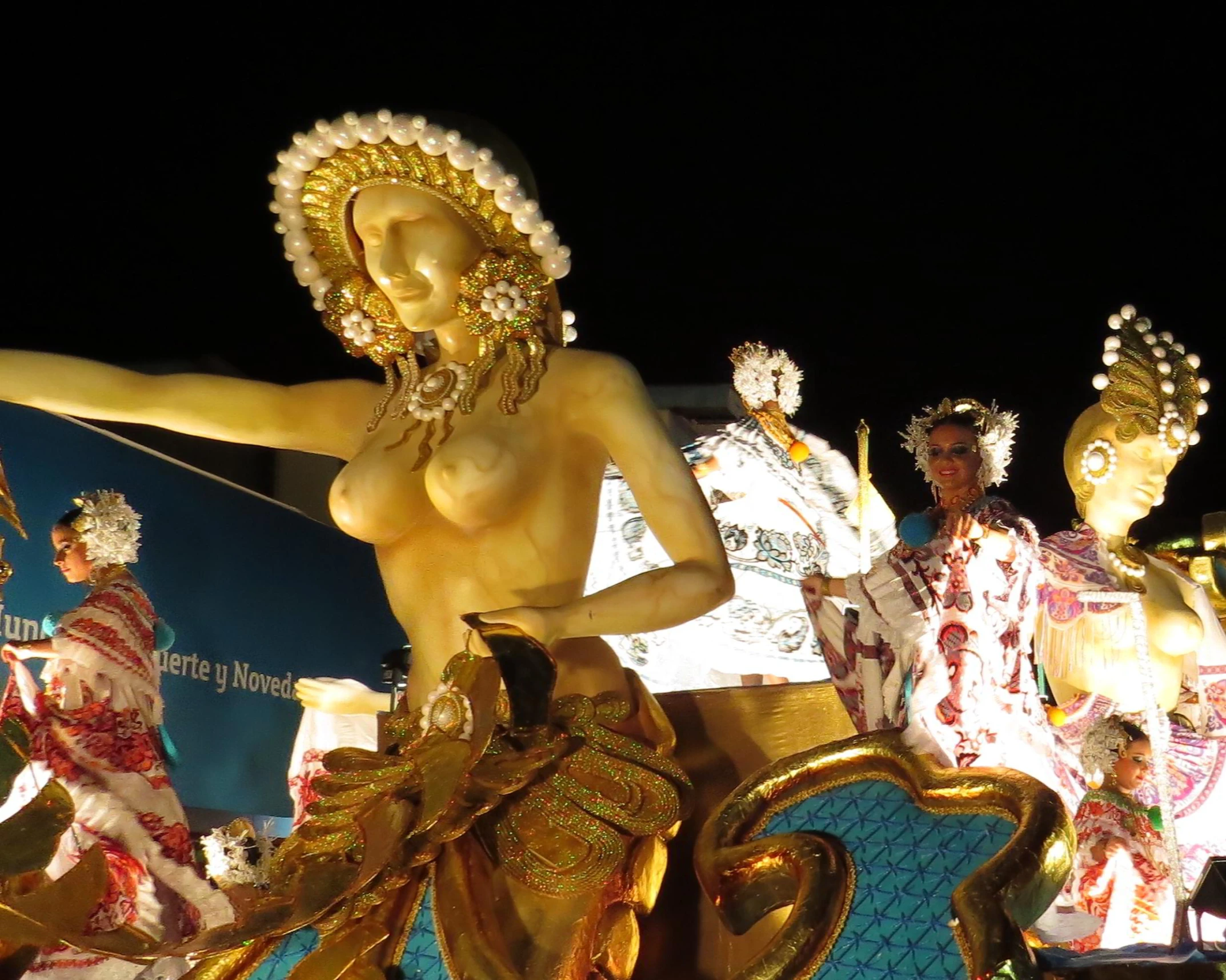 an elaborately decorated float featuring a female figure