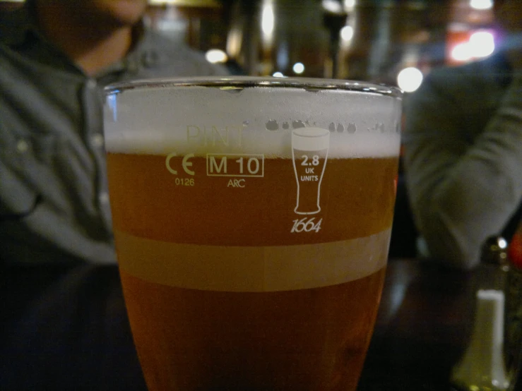 close up view of the side of a large glass full of liquid