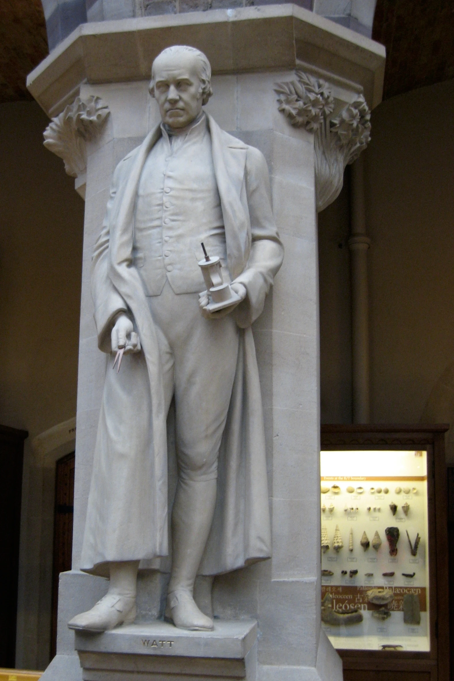 an image of a statue of a man holding a cup