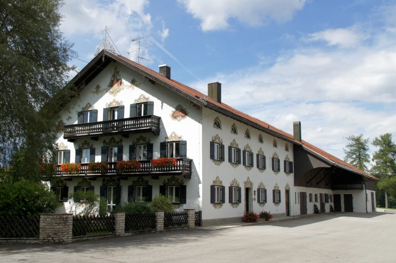 a large white building with many windows and balconies