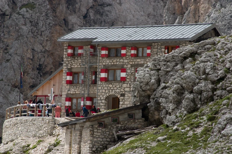 a building with several people standing around it