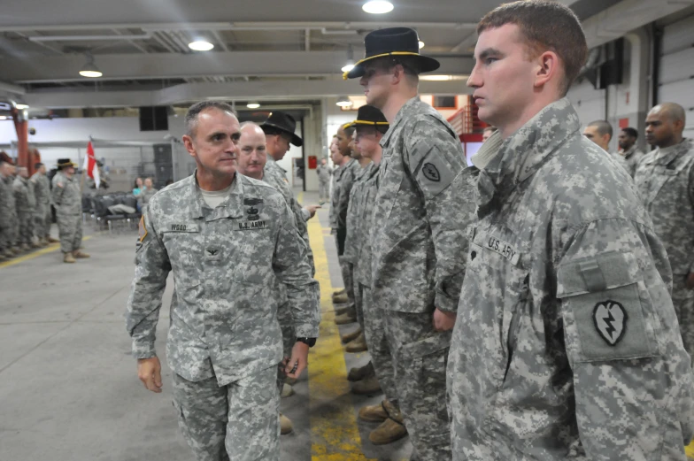 several men are in uniform while talking together