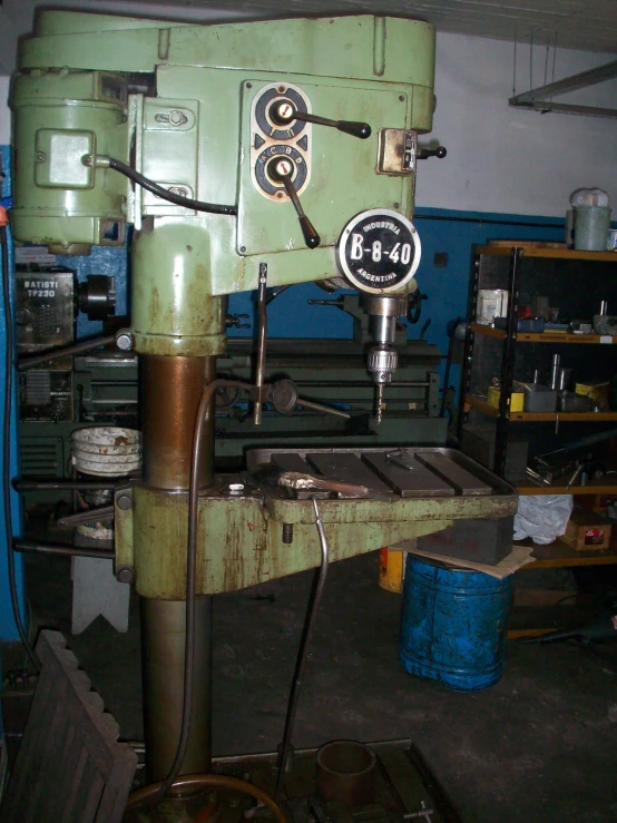 a machine working on the side of a metal surface