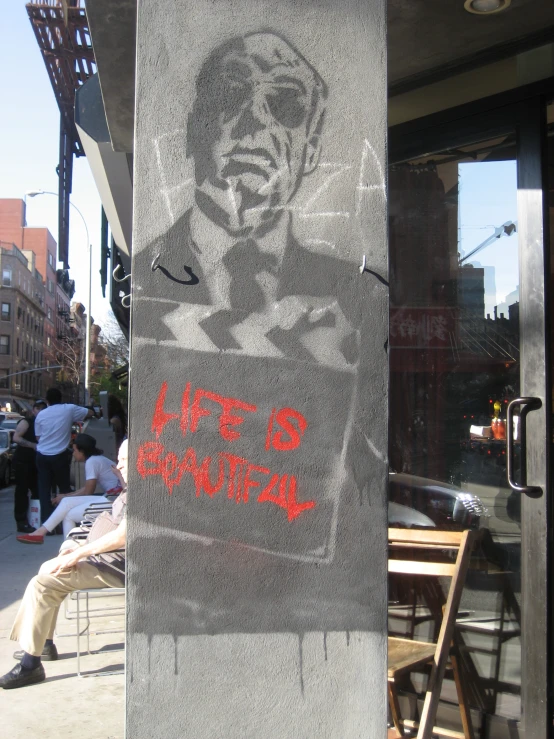 graffiti on the side of a wall showing a po of martin luther king