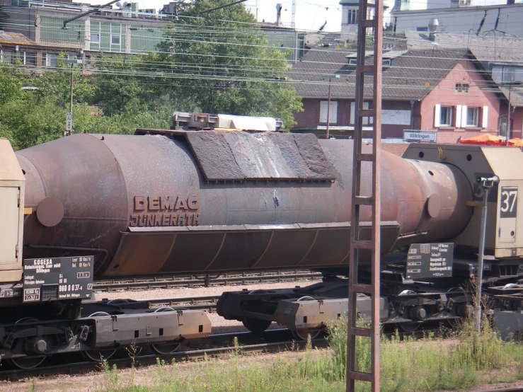 a large cargo train sitting on top of railroad tracks