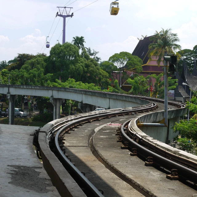 train tracks going past a street light