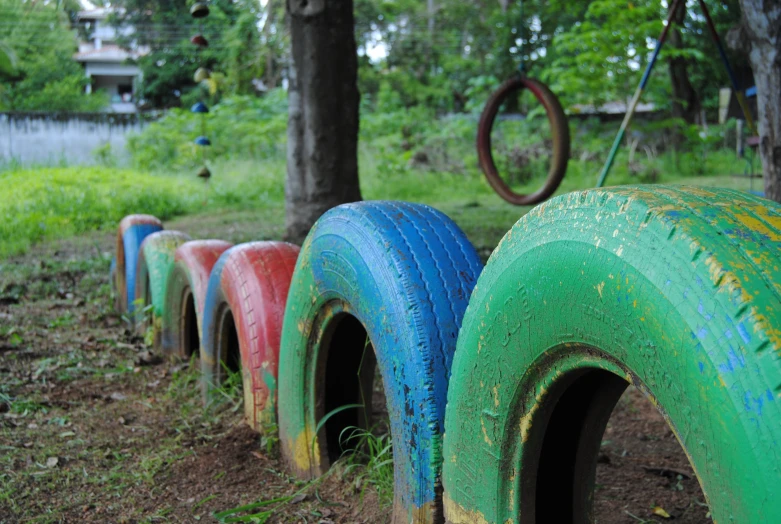 there are four different colored tire parts that are lined up