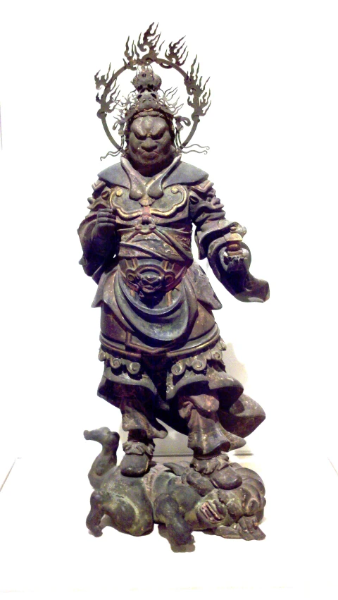 a metal statue with an ornate design