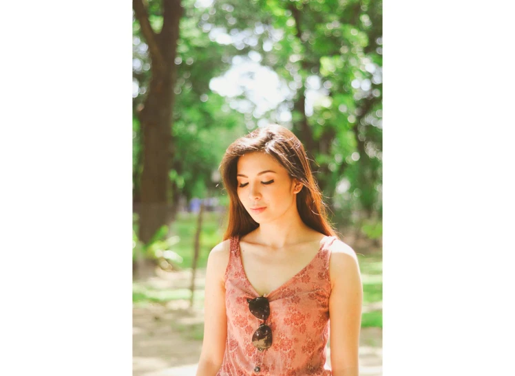  with long dark brown hair posing for a portrait