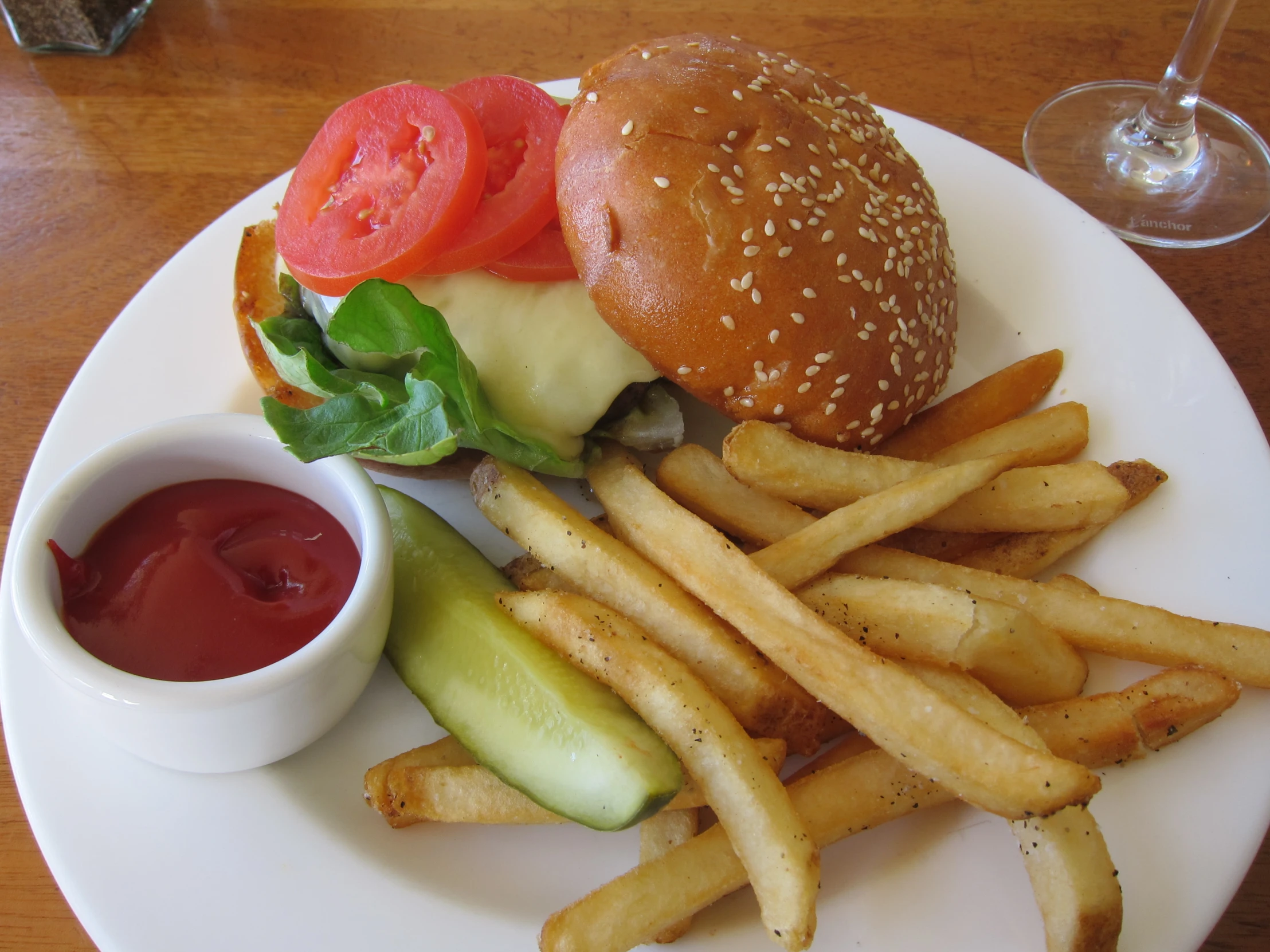 plate with burger, french fries and ketchup on it