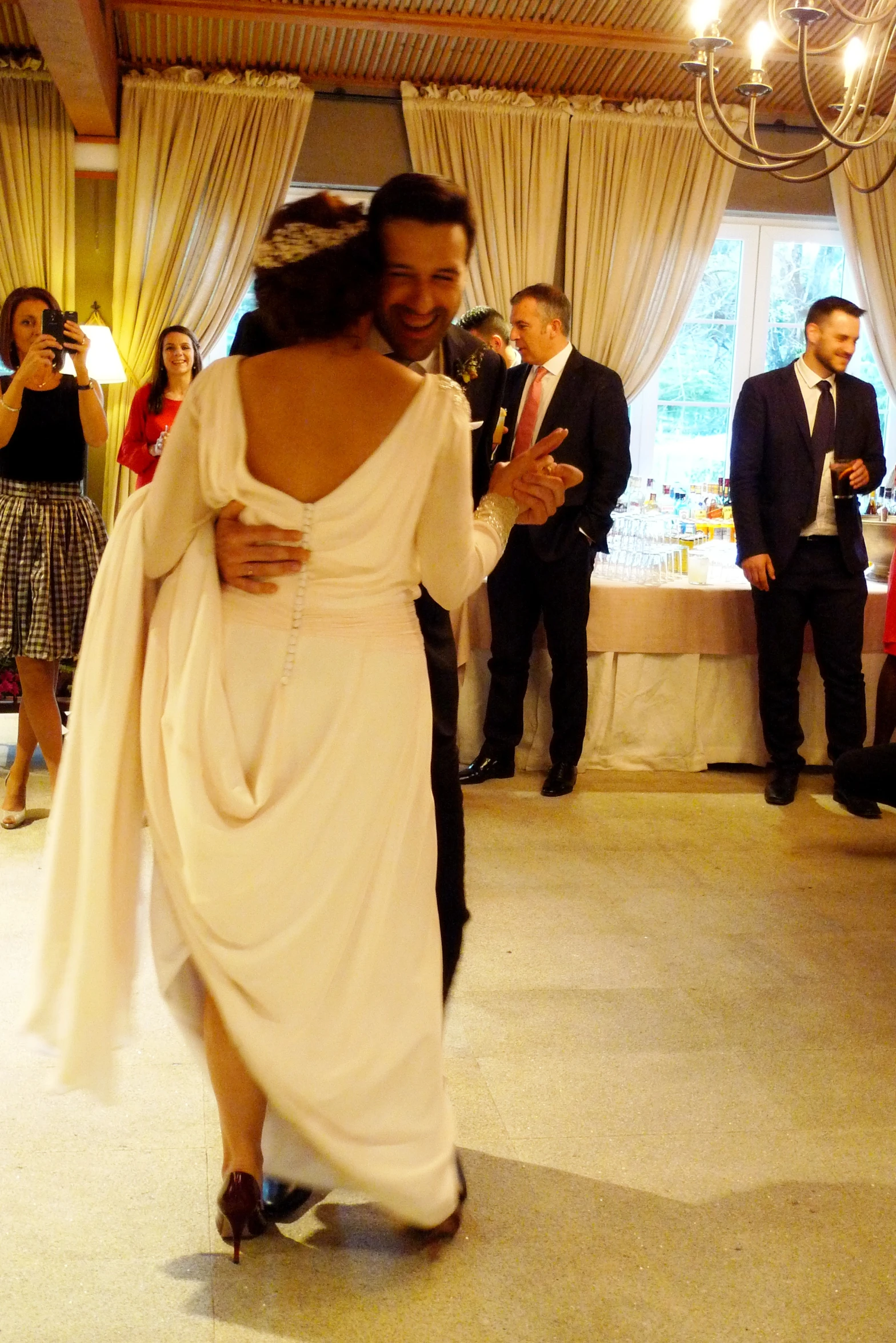 a man and woman dancing together in front of a crowd