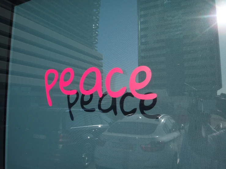 the word peace on a window in a storefront