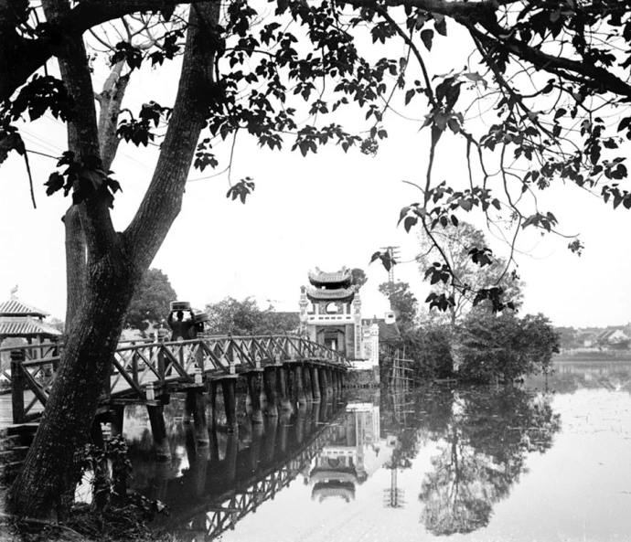 a black and white po of a bridge over water