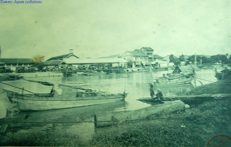 old time pograph of boatyard at river's edge