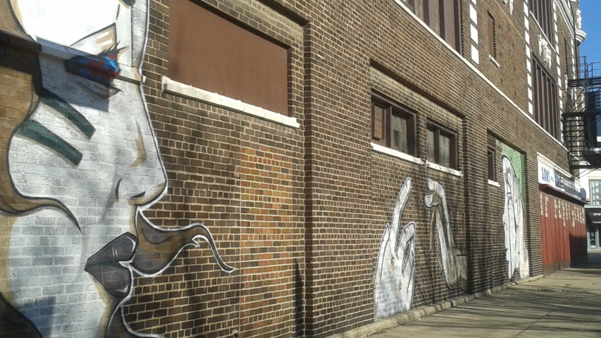 street view of a wall with some graffiti