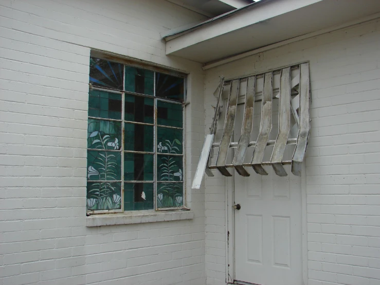 a picture of a home with green glass windows