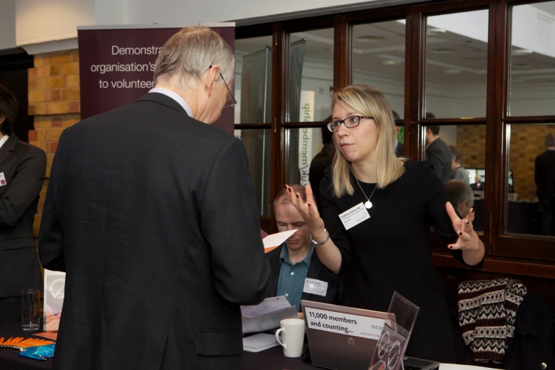 a man is explaining an information table