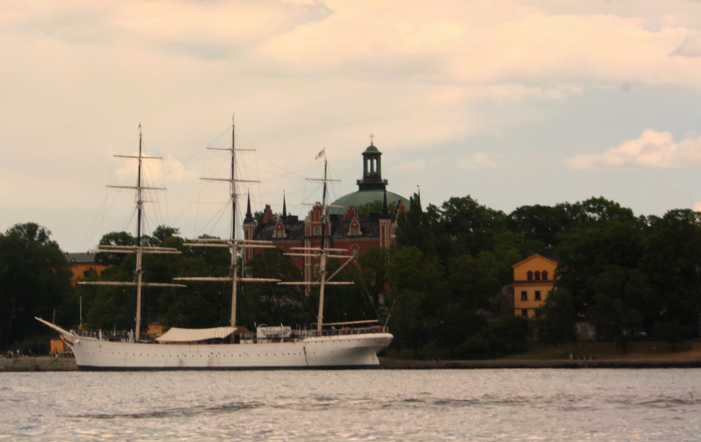 the large boat is sitting on the water