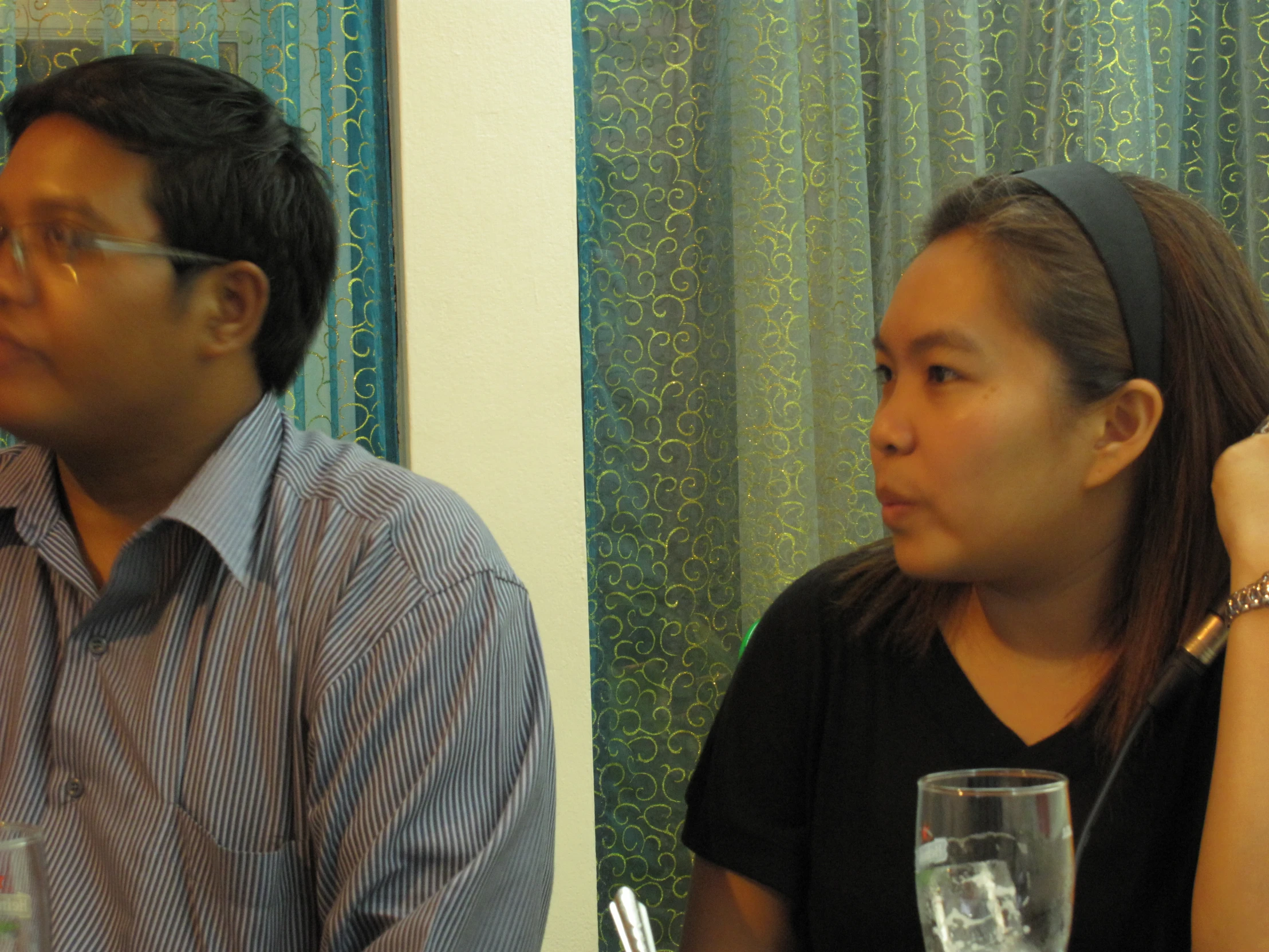 a man and a woman sitting at a table together