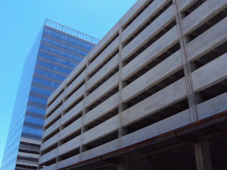 an under construction area and large building next to a freeway