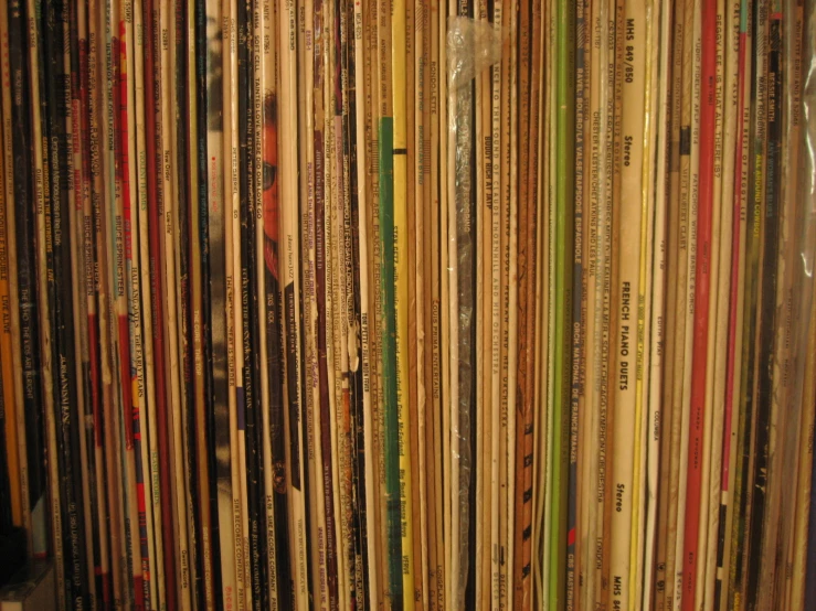 a wall that has various records stacked on it