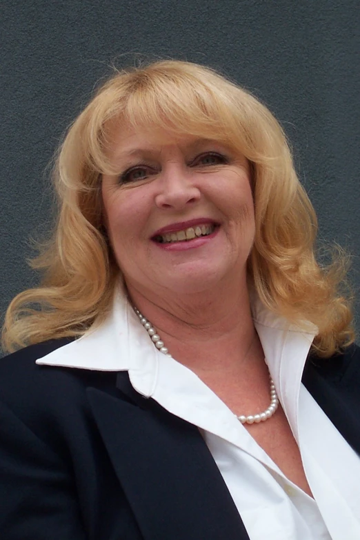 a woman smiling in an office environment