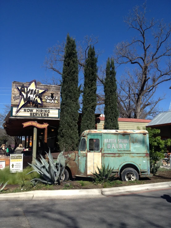 a large truck parked next to a store