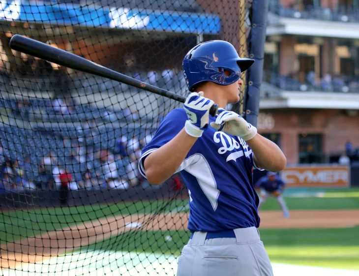 a baseball player taking a swing at the ball