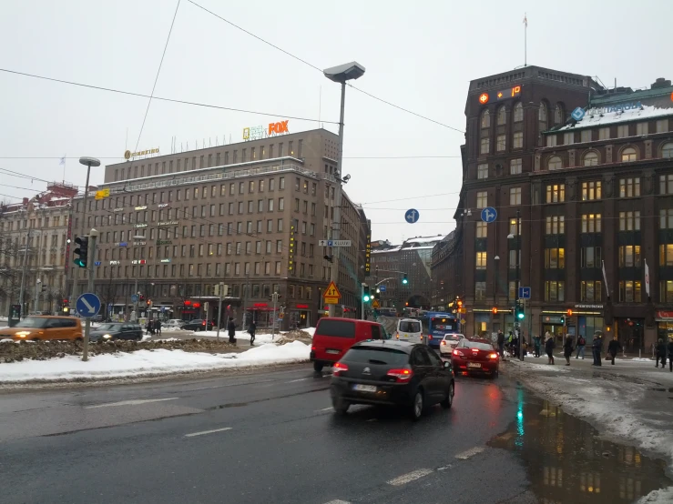 a car and some buildings during the day