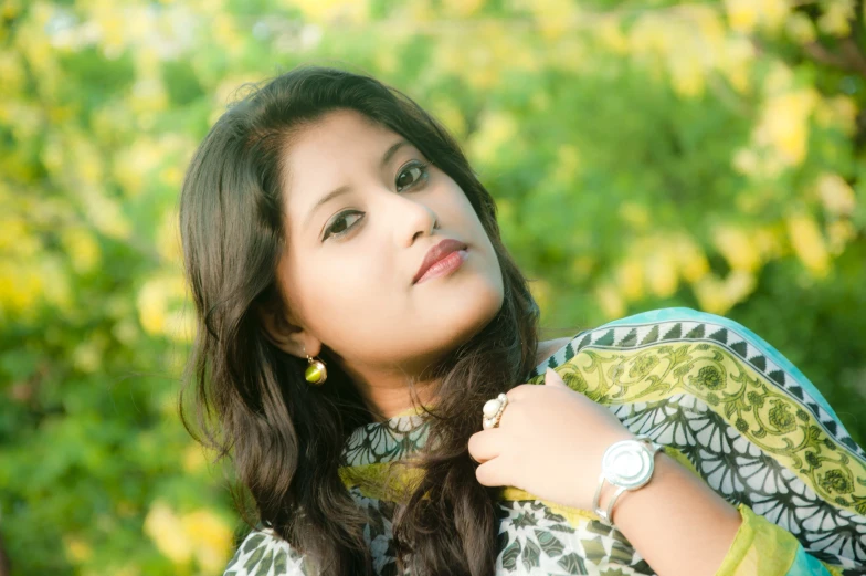 a girl with a watch poses for a pograph