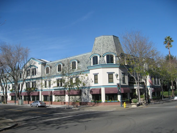 an older building has some blue and white trim on it