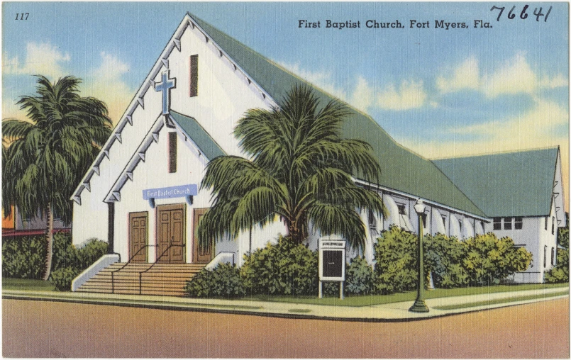 the front of a white church, with palm trees